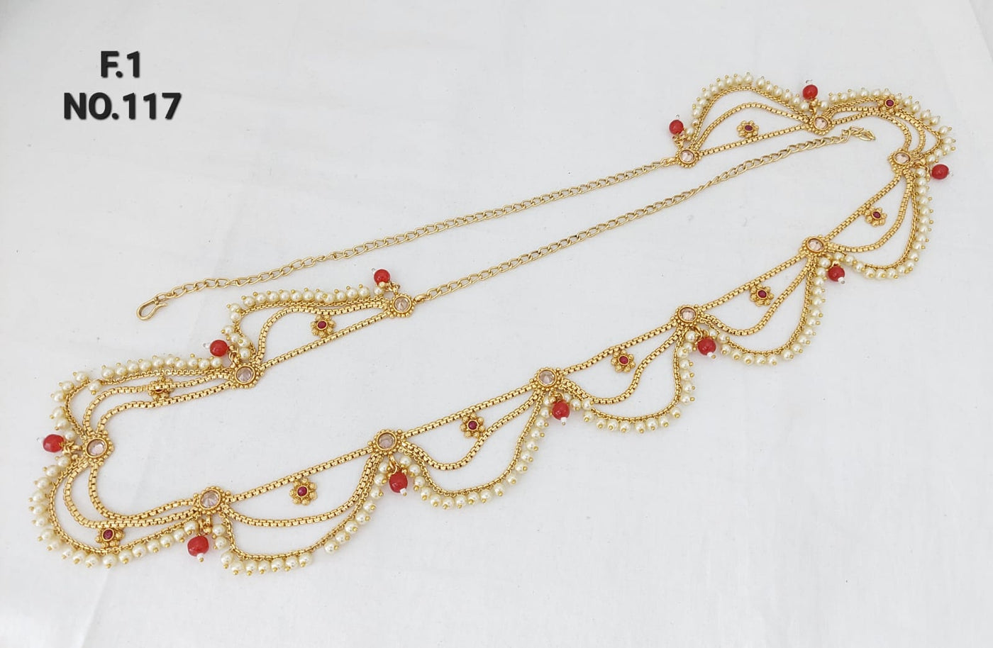 Gold plated chain and red waist belt