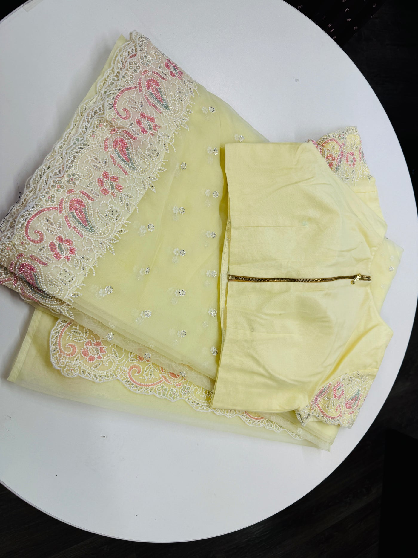 Pastel yellow embroidered Organza saree with stitched blouse