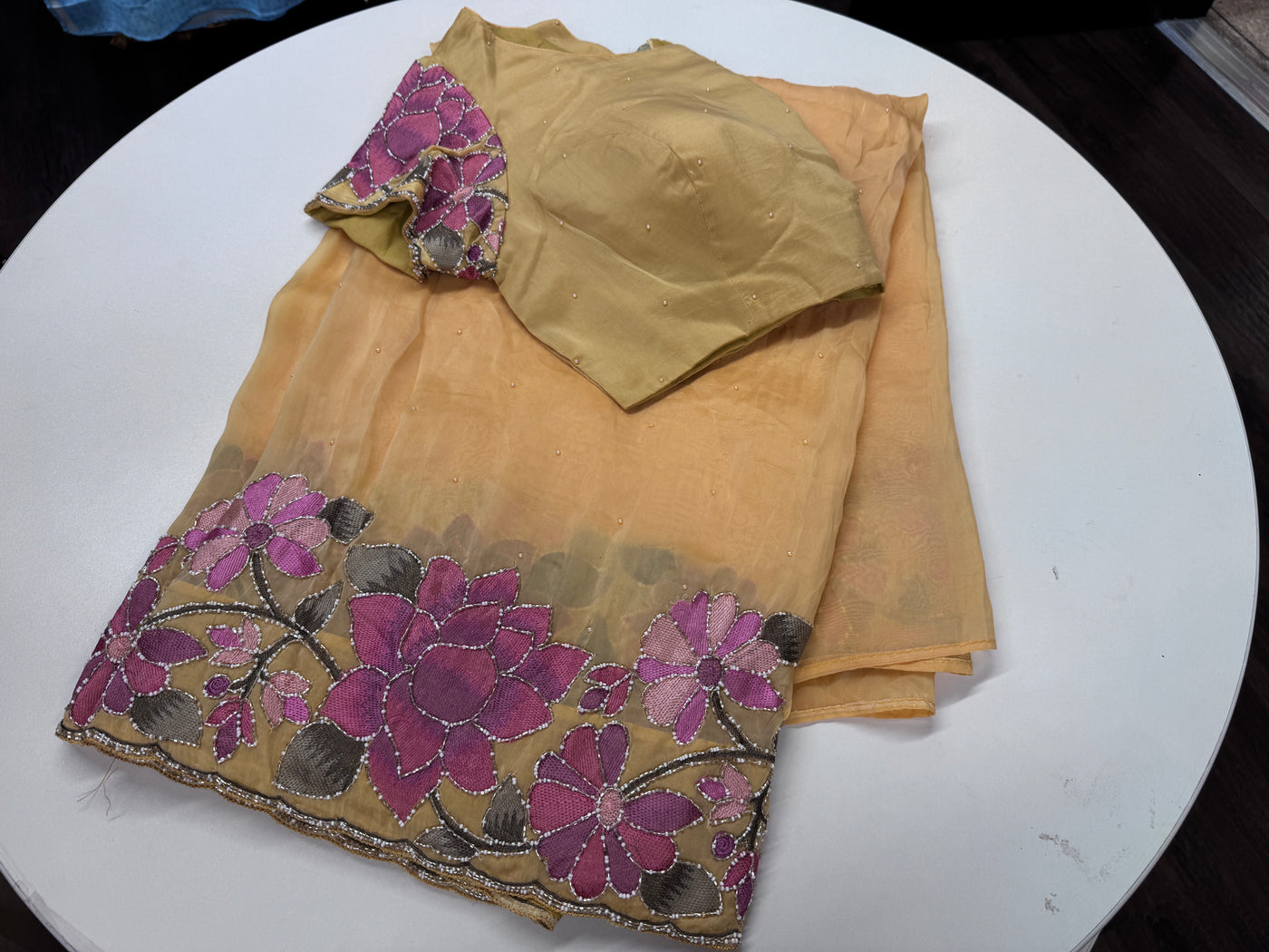 Mango yellow embroidered georgette saree with stitched blouse