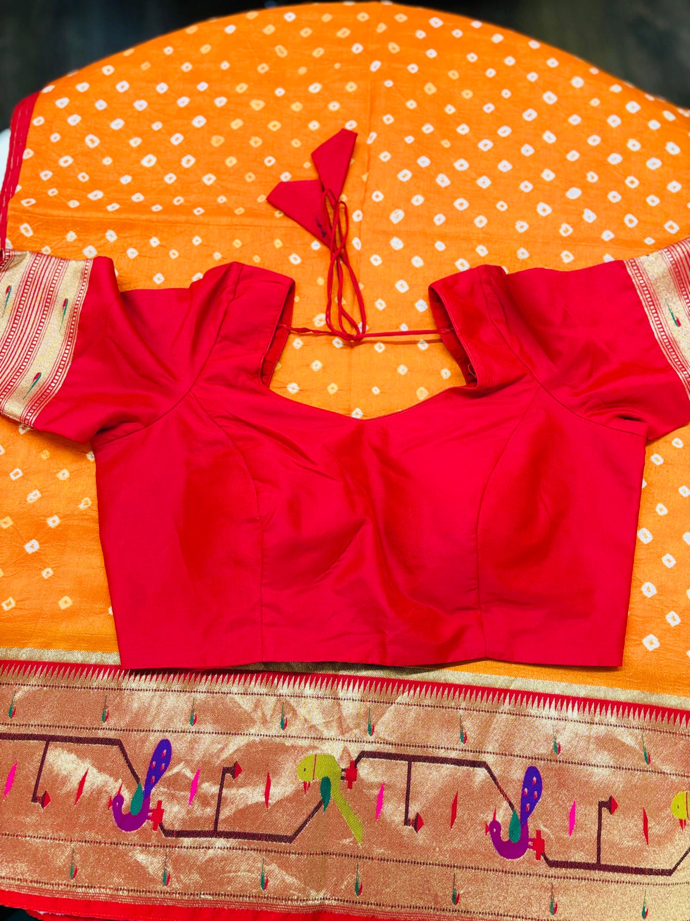 Orange Bandhani Saree with Traditional Paithani Parrot Border and Red Blouse