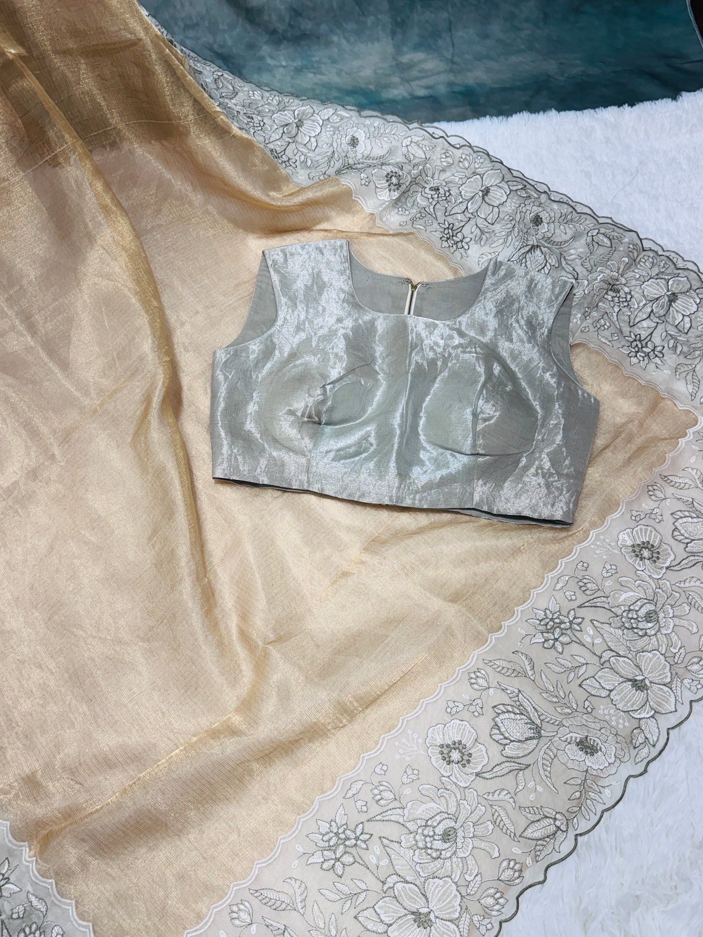 Golden Tissue Saree with Silver Floral Embroidery & High Neck Blouse