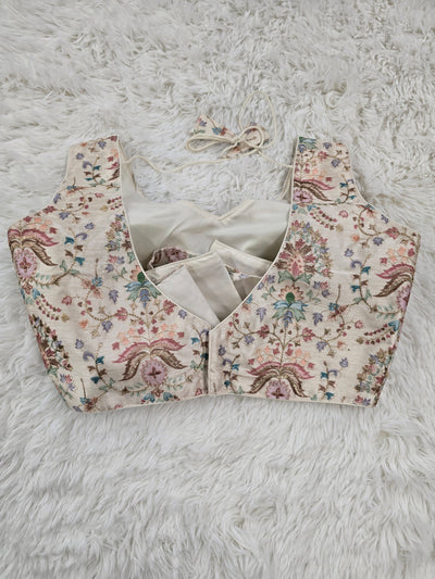Cream Woven Silk Readymade Blouse – V-Neck Design with Pastel Floral Weaving & Tassel Tie-Back