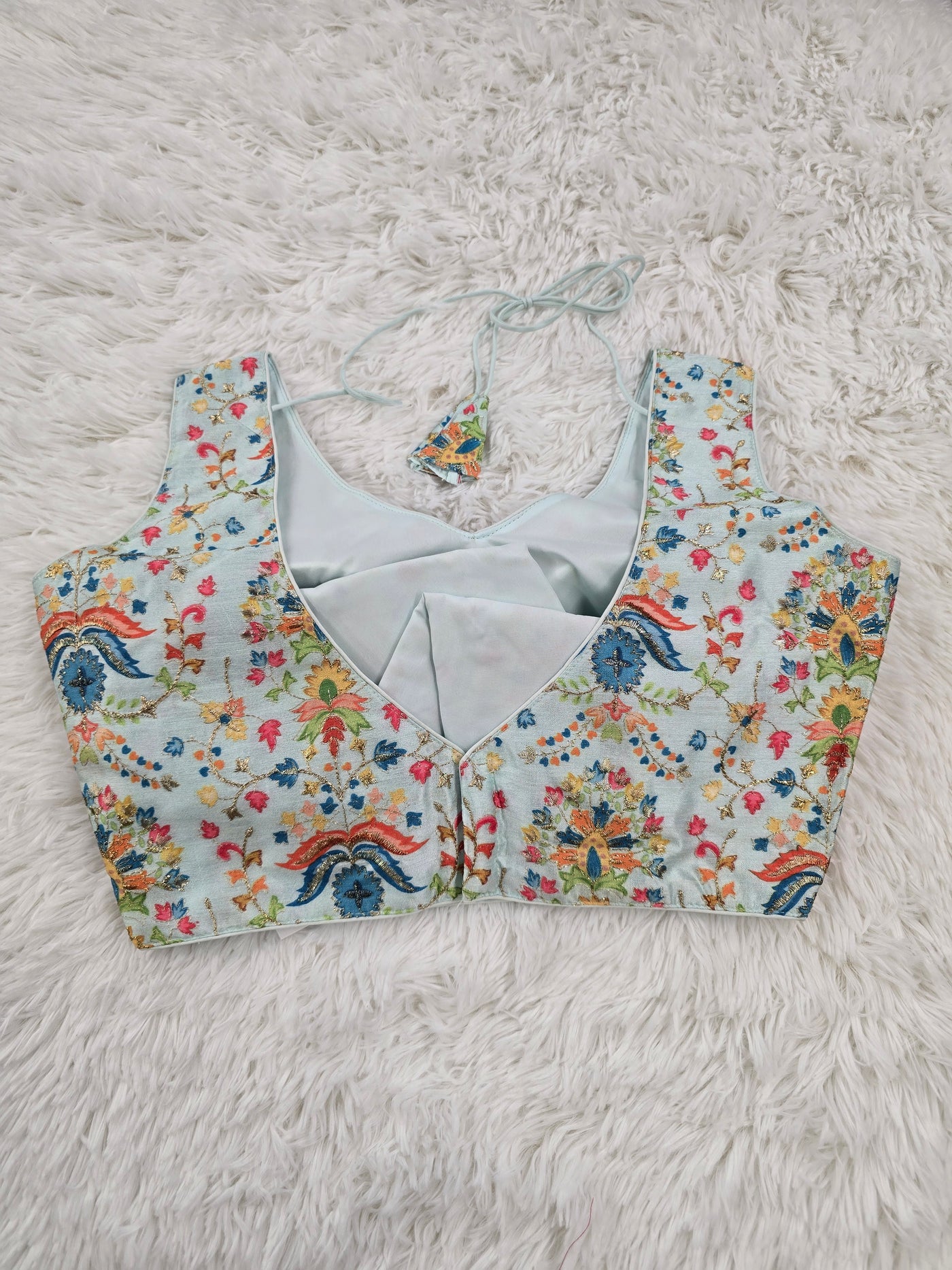 Sky Blue Woven Silk Readymade Blouse – V-Neck Design with Multicolor Floral Weaving & Tassel Tie-Back