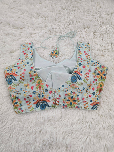 Sky Blue Woven Silk Readymade Blouse – V-Neck Design with Multicolor Floral Weaving & Tassel Tie-Back