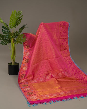 Berry pink Kanjeevaram saree with stitched blouse